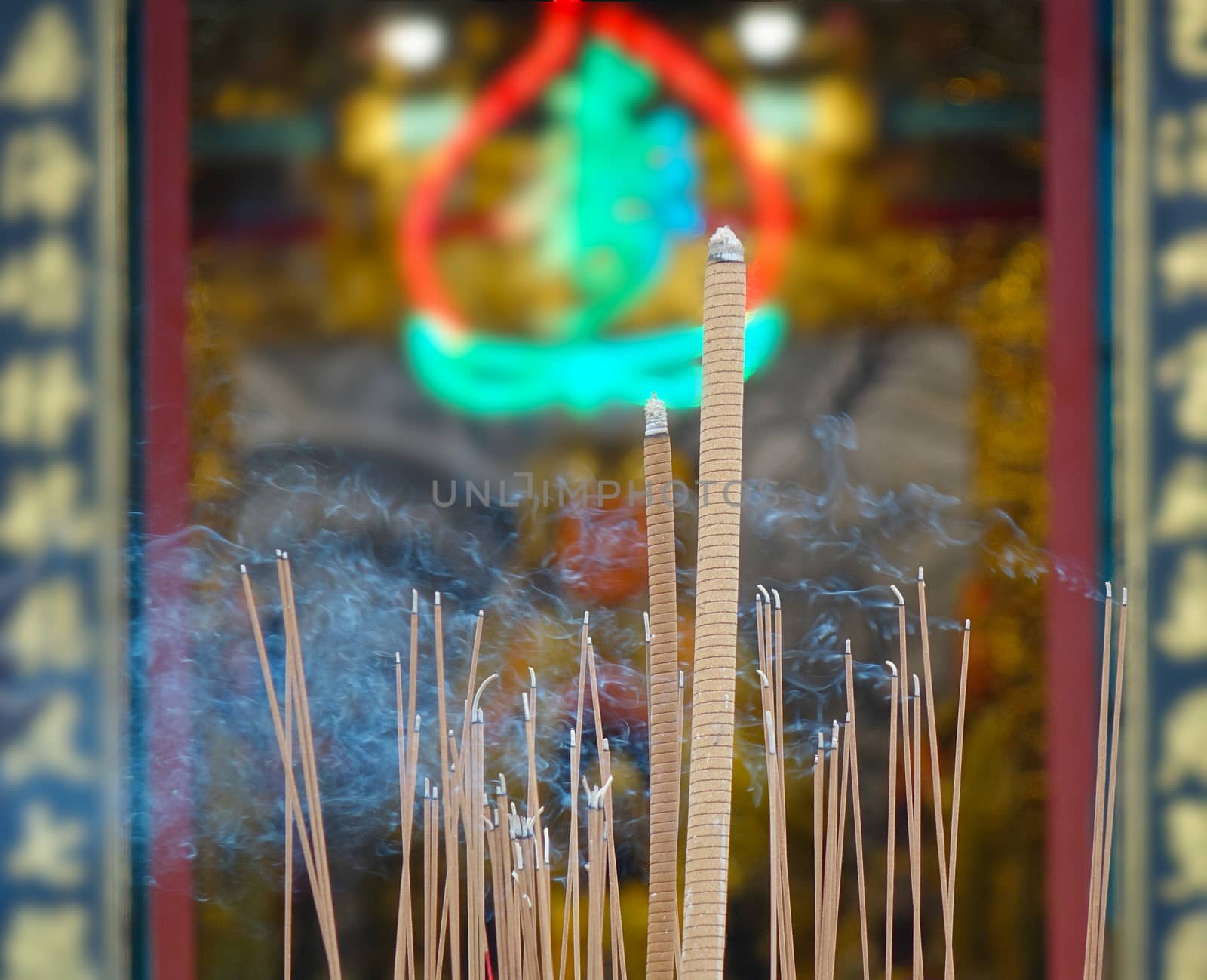 Incense sticks are being burned at a Chinese temple
