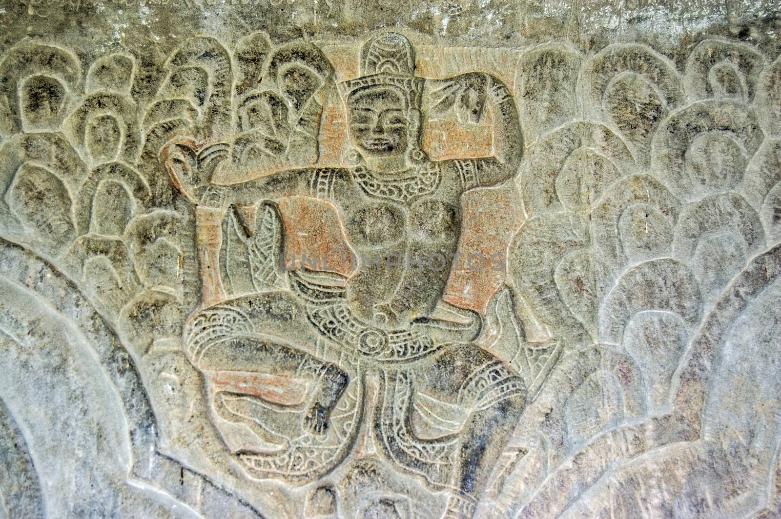 Bas relief carving of a dancing figure.  Wall of Angkor Wat Temple, Siem Reap, Cambodia.