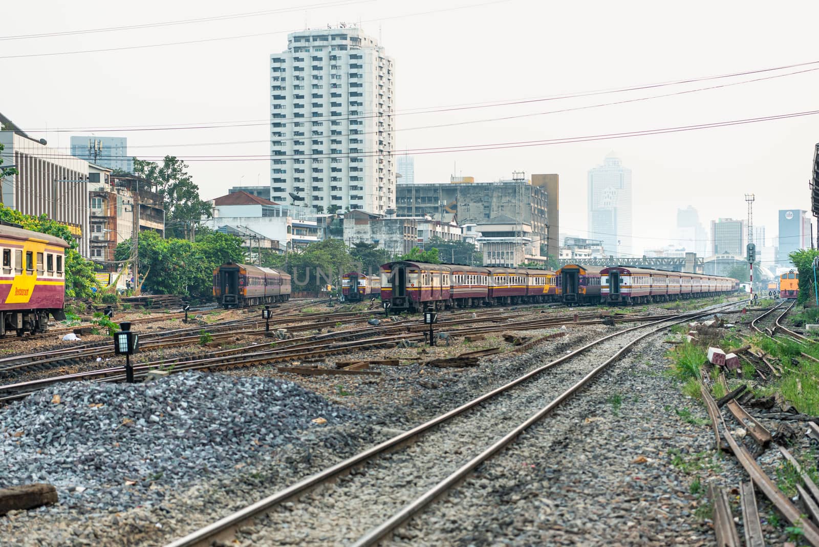 Bangkok, Thailand - January 17, 2020 : Unidentified railway train on the railroad tracks in Bangkok station. Many people in Thailand popular travel by train because it is cheaper.