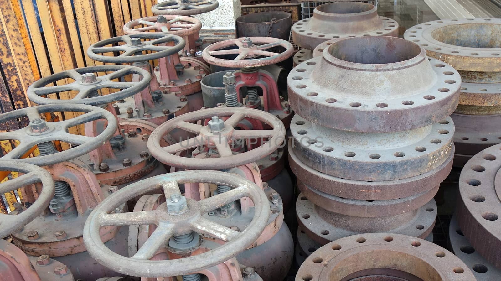A collection of massive ship valves with large handwheels