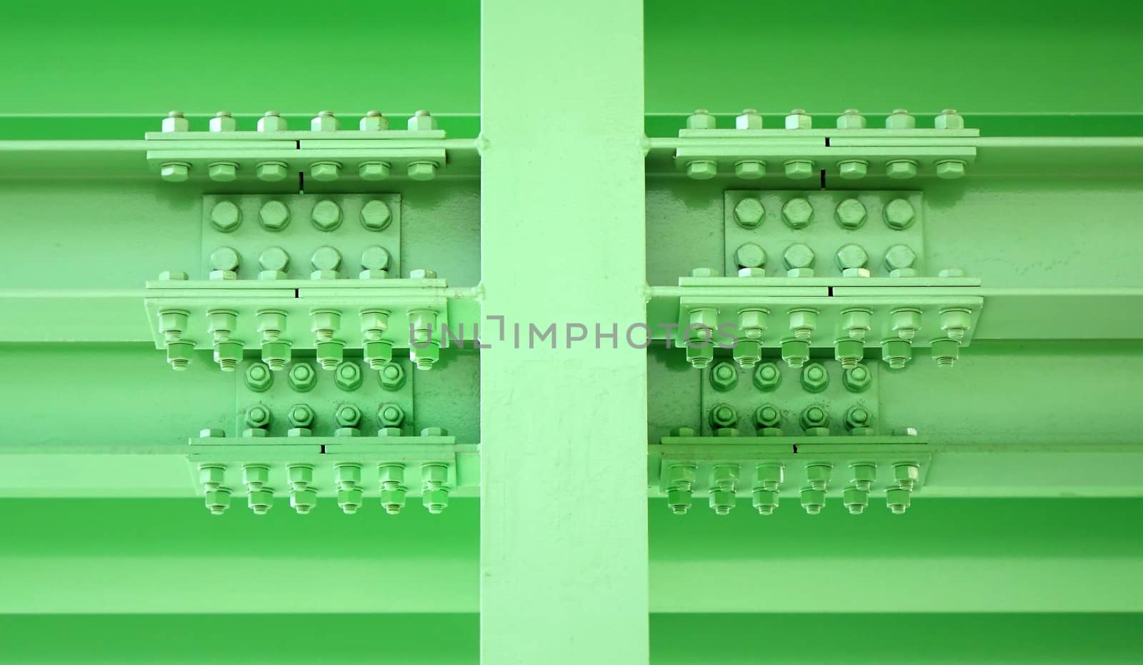 Massive steel girder construction with multiple large bolts and nuts

