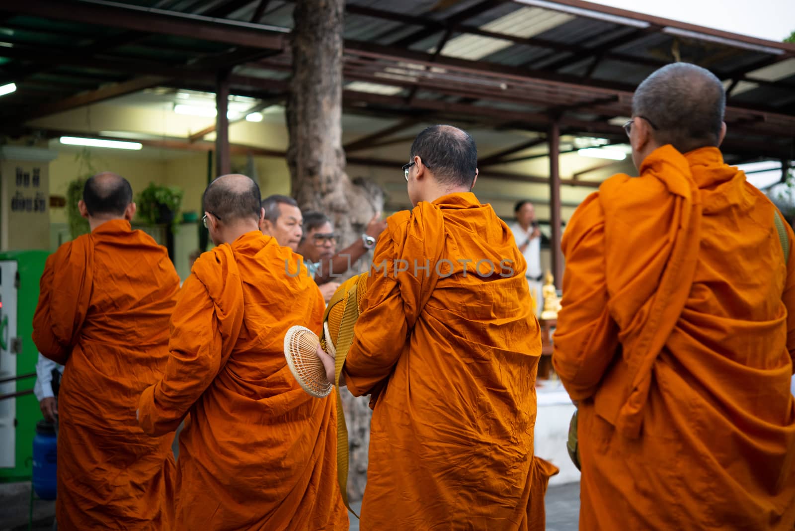 Thai monk ask for alms for buddhist to make merit by PongMoji