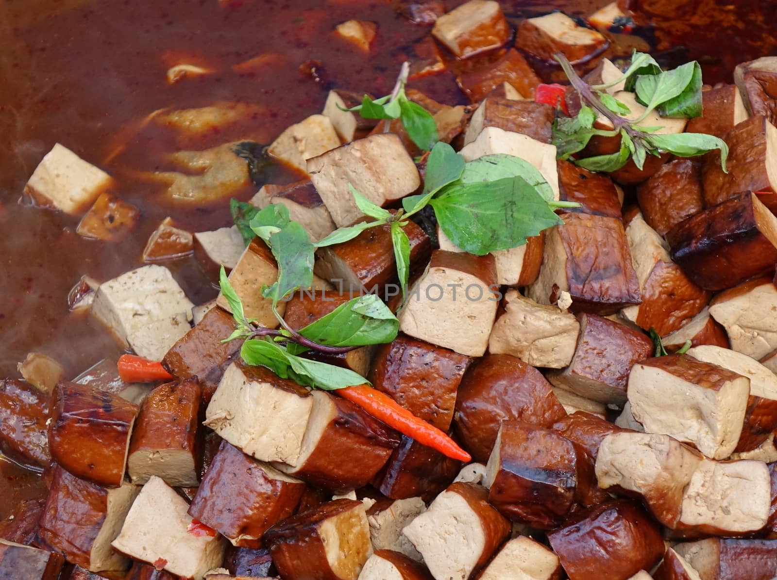 Pressed bean curd with chilies and fresh basil