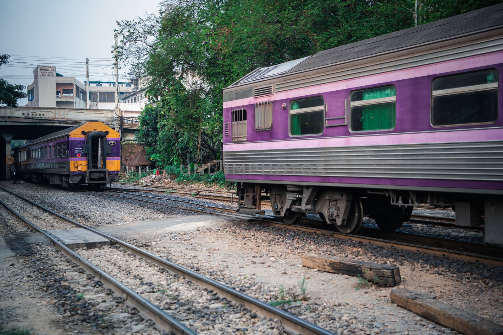 Bangkok, Thailand - January 17, 2020 : Unidentified railway train on the railroad tracks in Bangkok station. Many people in Thailand popular travel by train because it is cheaper.