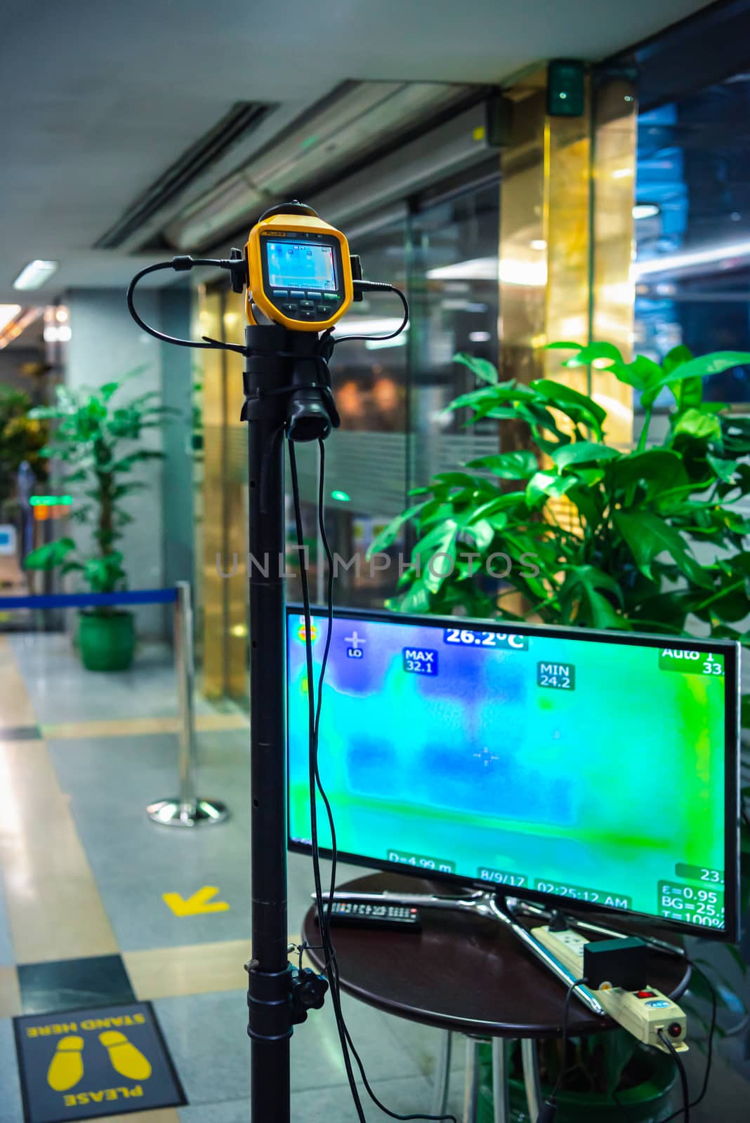 Bangkok, Thailand - March 17, 2020 : Unidentified people waiting body temperature check to access building for against epidemic flu covid19 or corona virus by thermoscan or infrared thermal camera