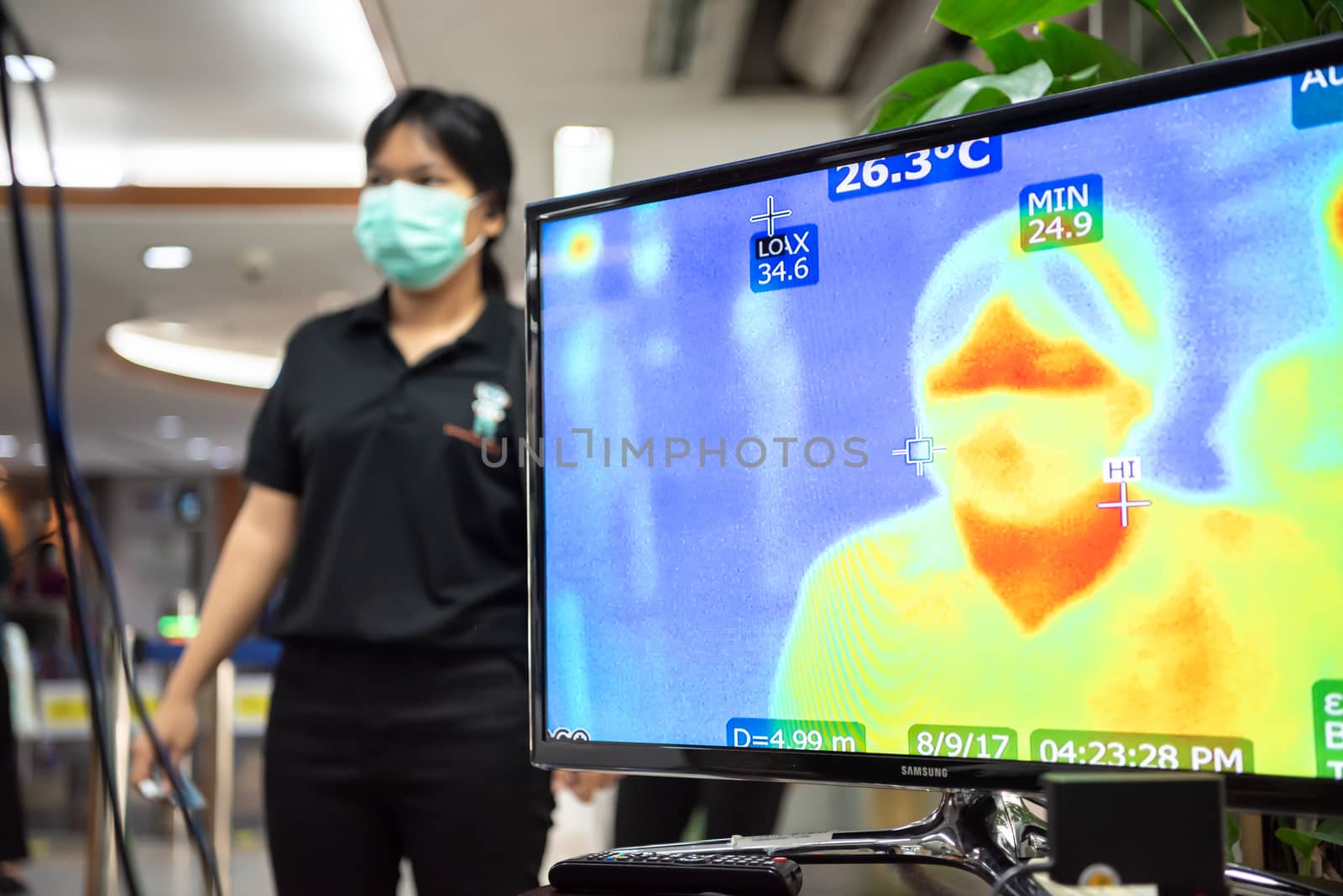 Bangkok, Thailand - March 18, 2020 : Unidentified people waiting body temperature check to access building for against epidemic flu covid19 or corona virus by thermoscan or infrared thermal camera