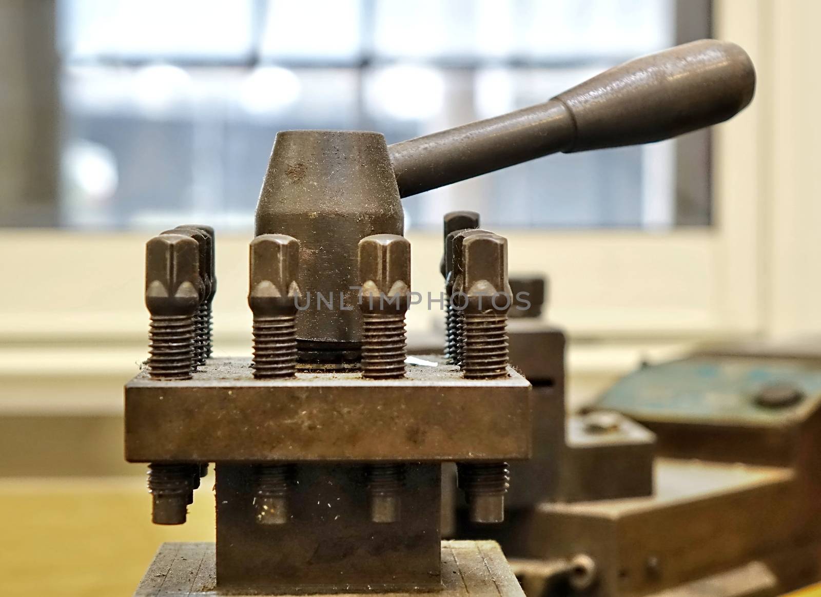 Well used industrial equipment with large nuts and bolts
