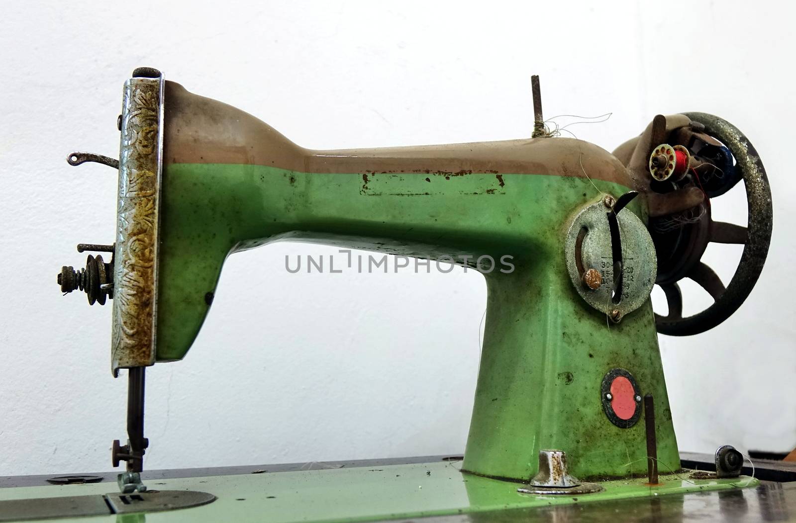 Vintage obsolete sewing machine that is operated by foot
