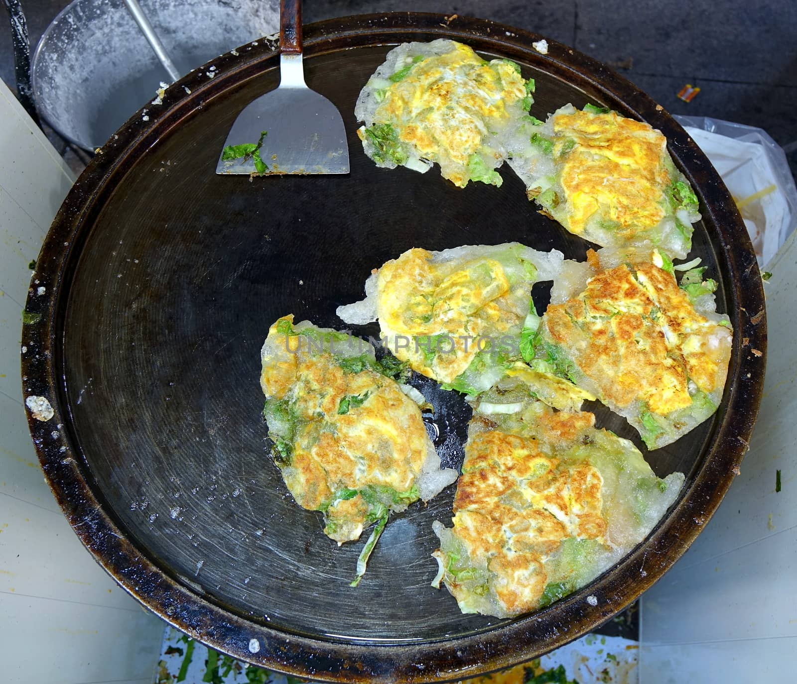 Oyster omelets with fresh greens are a popular Taiwan street food
