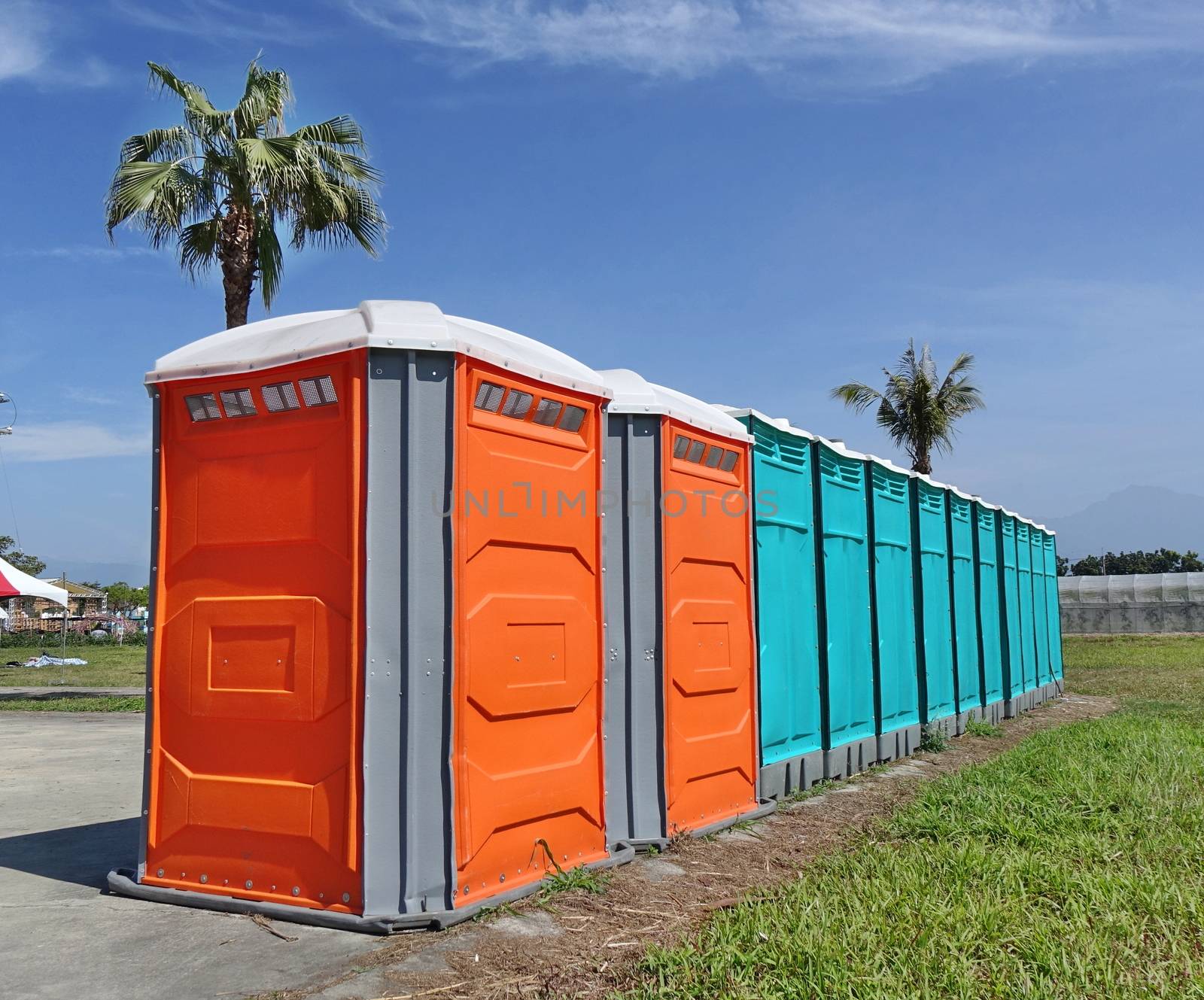 A row of portable toilets set up at a public event
