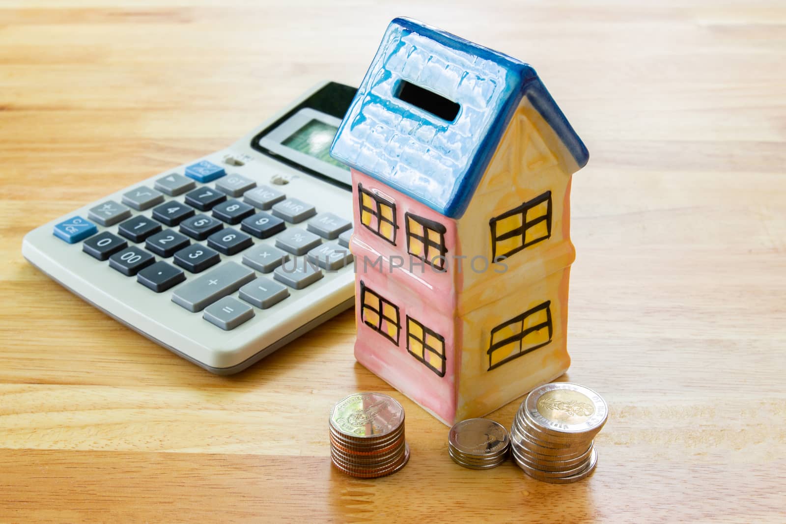 Model house with calculator, concept 

Buying a house, residence, business, finance