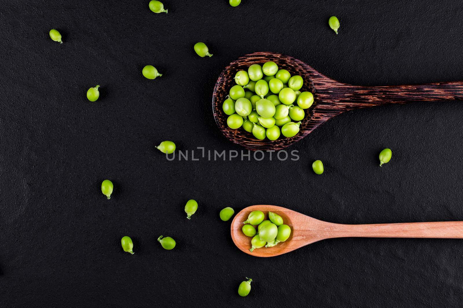 Sugar snap peas with mint on a rustic wood background