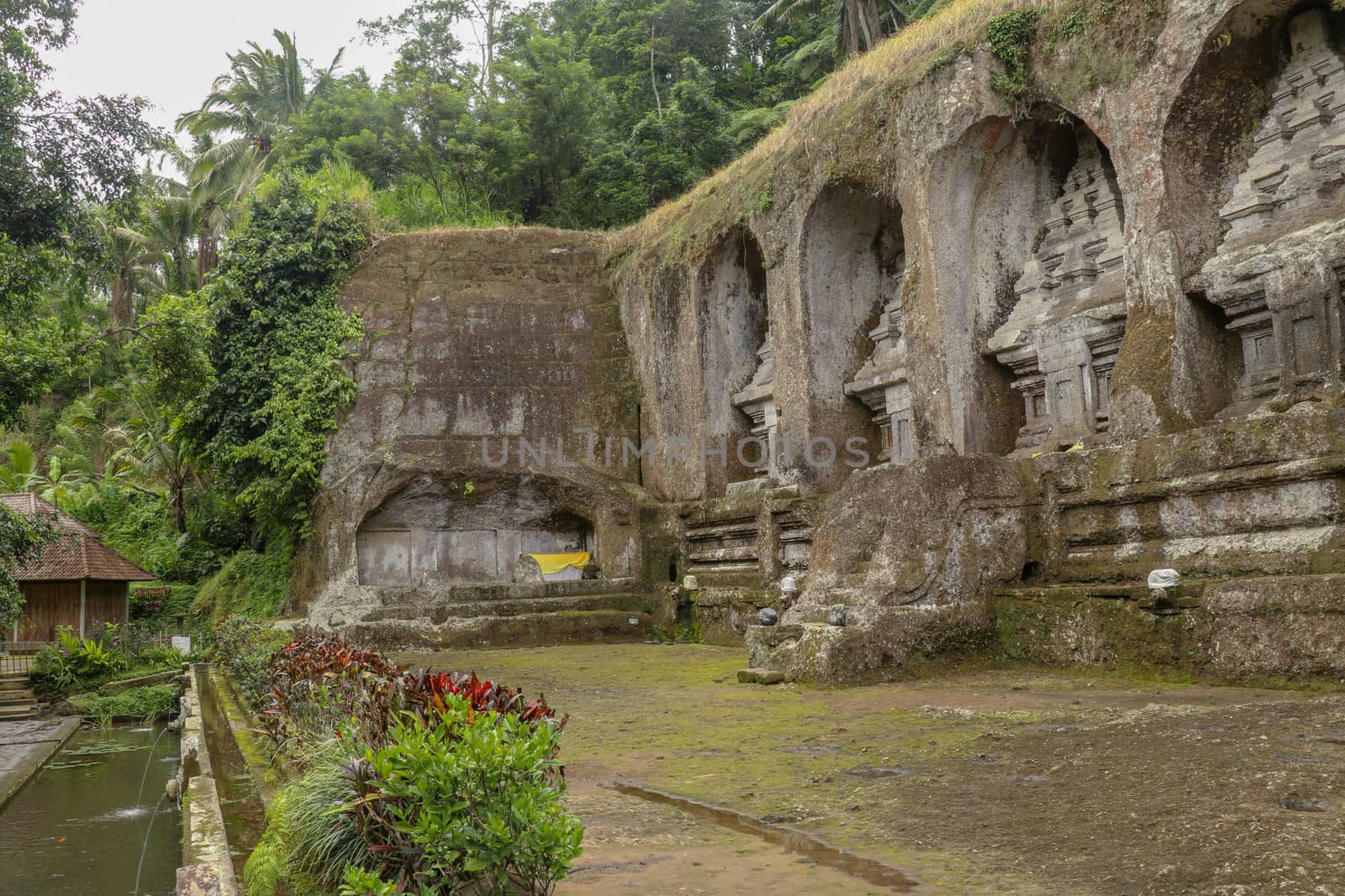 Ganung Kawi Temple complex centered around Royal Tombs carved into stone cliffs in the 11th century. Bali, Indonesia. Funeral temple complex centered around royal tombs carved into stone cliffs.