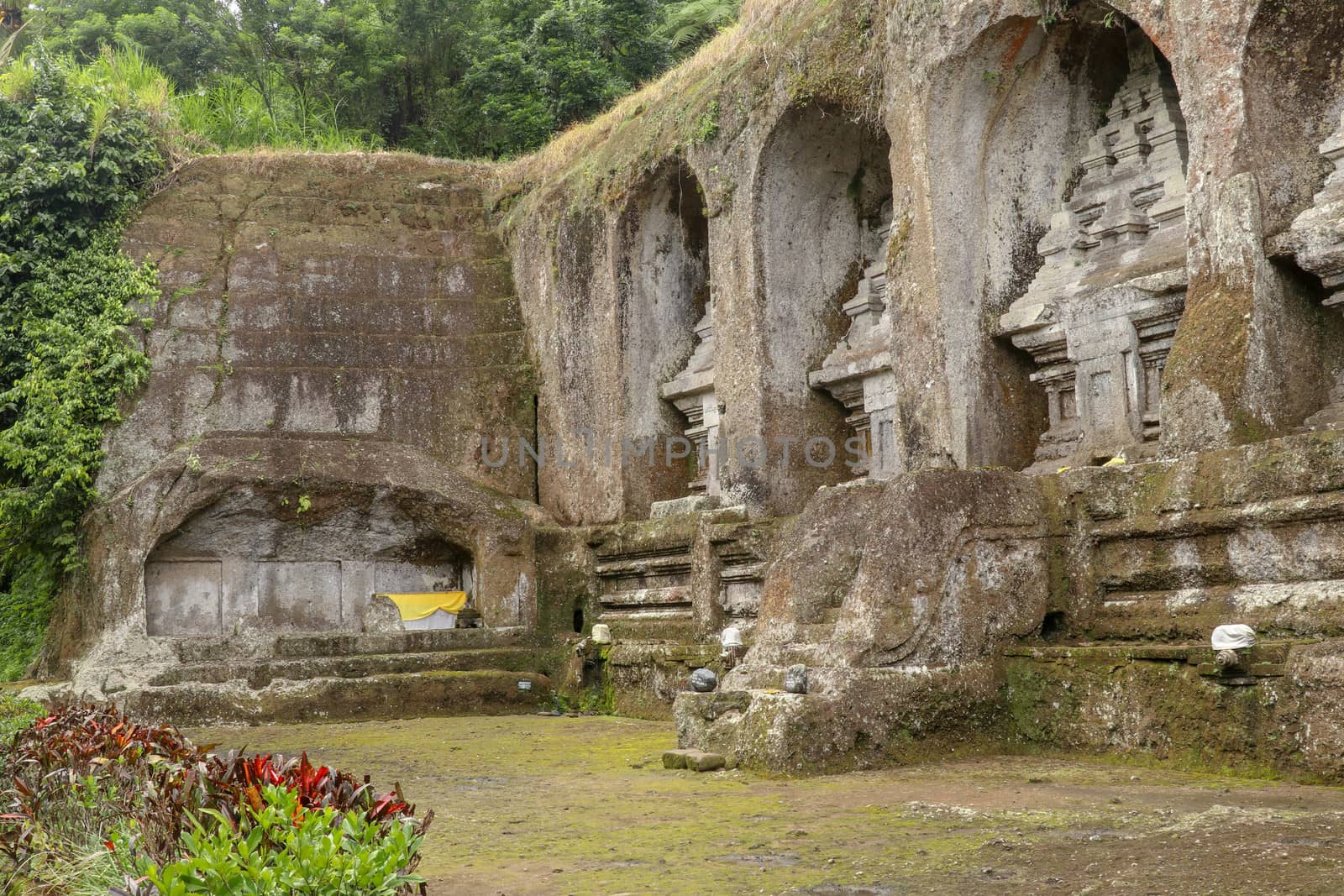 Ganung Kawi Temple complex centered around Royal Tombs carved into stone cliffs in the 11th century. Bali, Indonesia. Funeral temple complex centered around royal tombs carved into stone cliffs.
