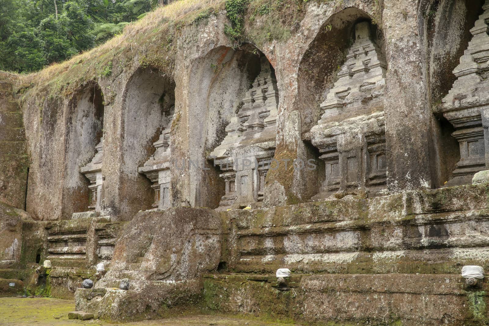 Ganung Kawi Temple complex centered around Royal Tombs carved into stone cliffs in the 11th century. Bali, Indonesia. Funeral temple complex centered around royal tombs carved into stone cliffs.