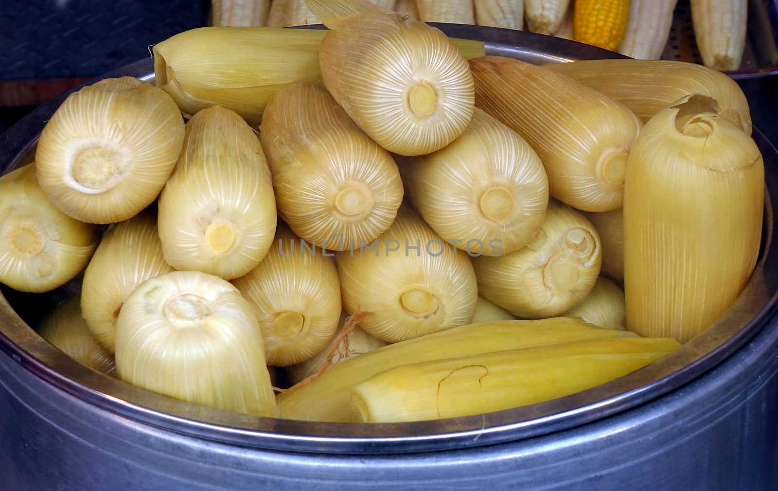 A market stall sells freshly steamed corn