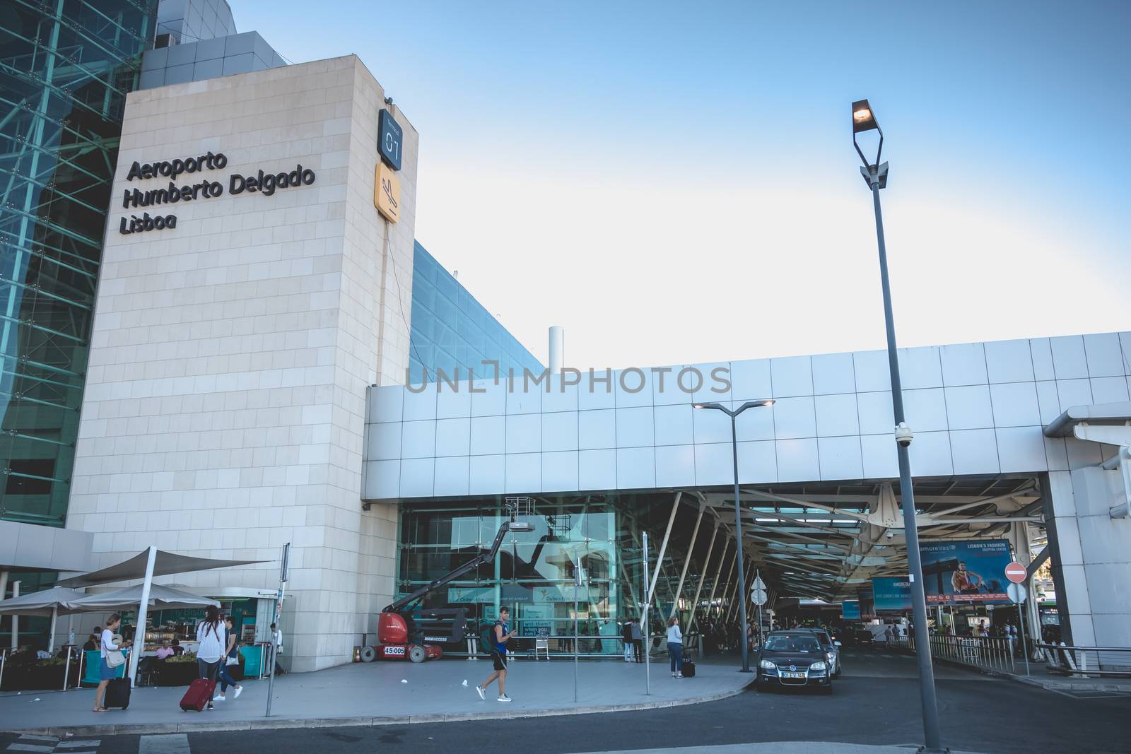 Lisbon, Portugal - August 7, 2018: exterior view of Lisbon International Airport where travelers walk on a summer day