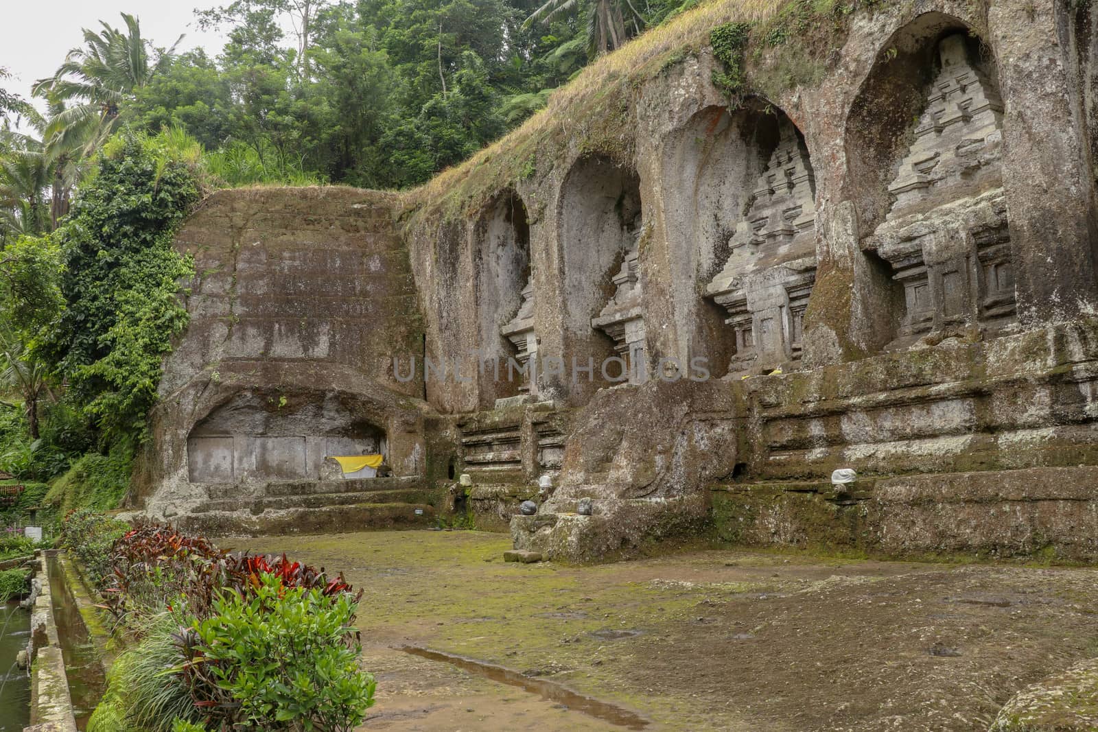 Ganung Kawi Temple complex centered around Royal Tombs carved into stone cliffs in the 11th century. Bali, Indonesia. Funeral temple complex centered around royal tombs carved into stone cliffs.