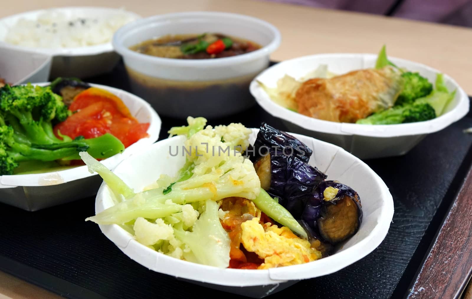 A Chinese lunch set with beef stew and assorted vegetables
