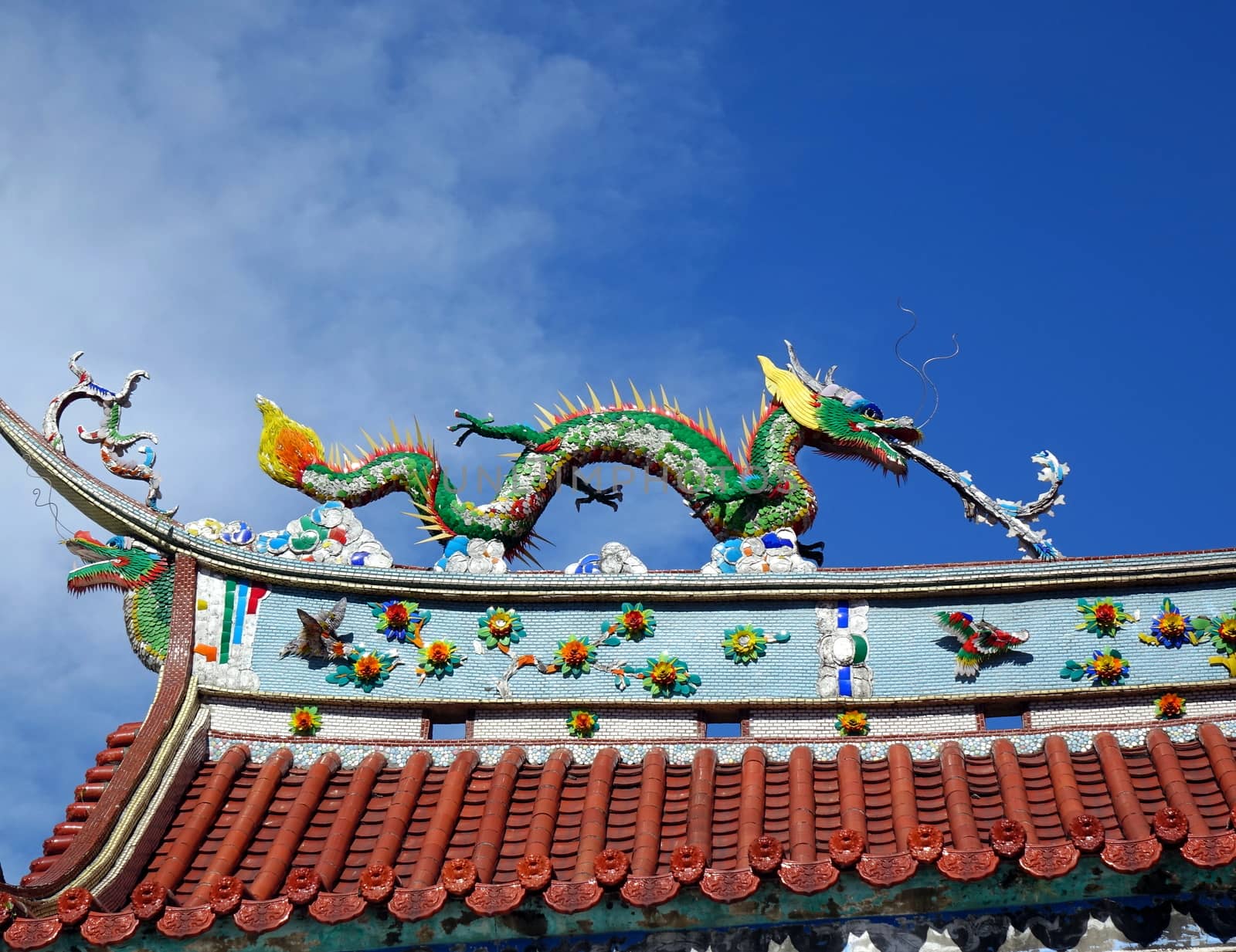 Chinese temple roof ridge decorated with mythological beasts