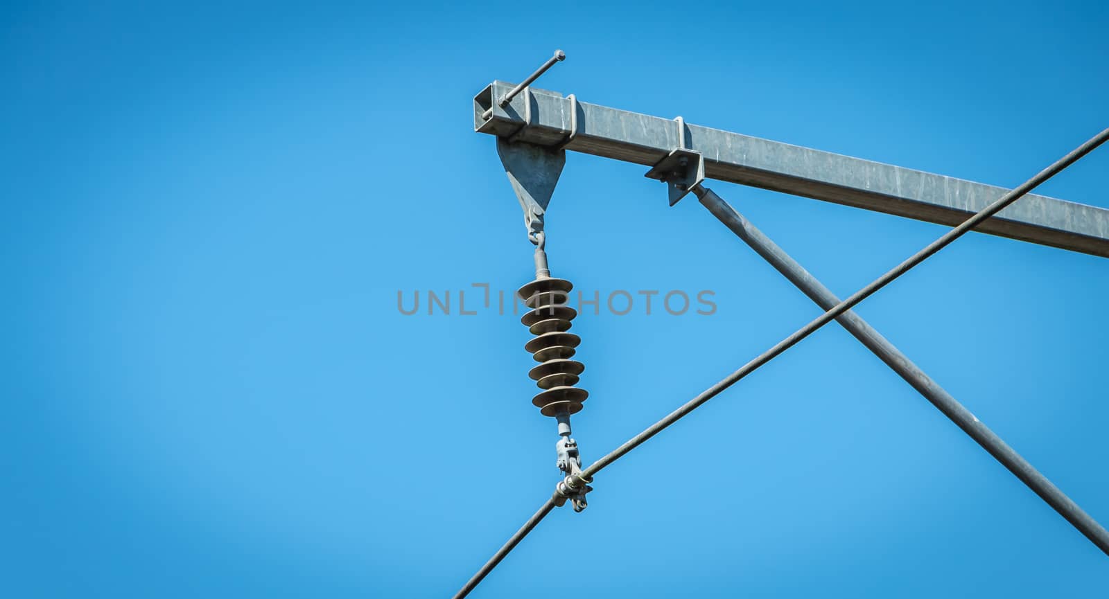 closeup of a catenary on a background of blue sky in France