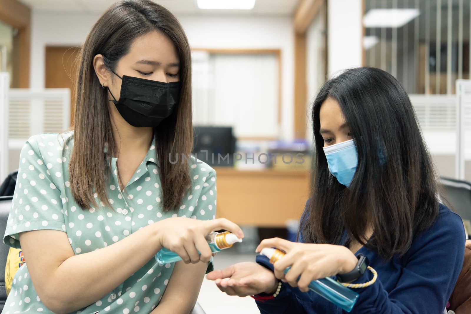 Asian women wearing mask and alcohol antibacterial hand gel respiratory protection mask against epidemic flu covid19 or corona virus with fear emotion in concept illness, outbreak, healthcare in life