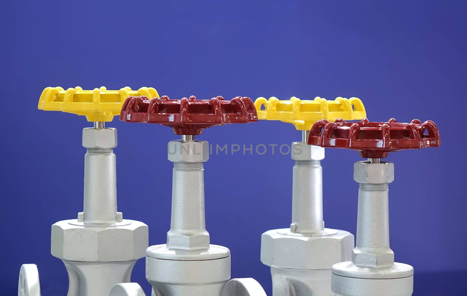 Red and yellow hand wheels for industrial valves
