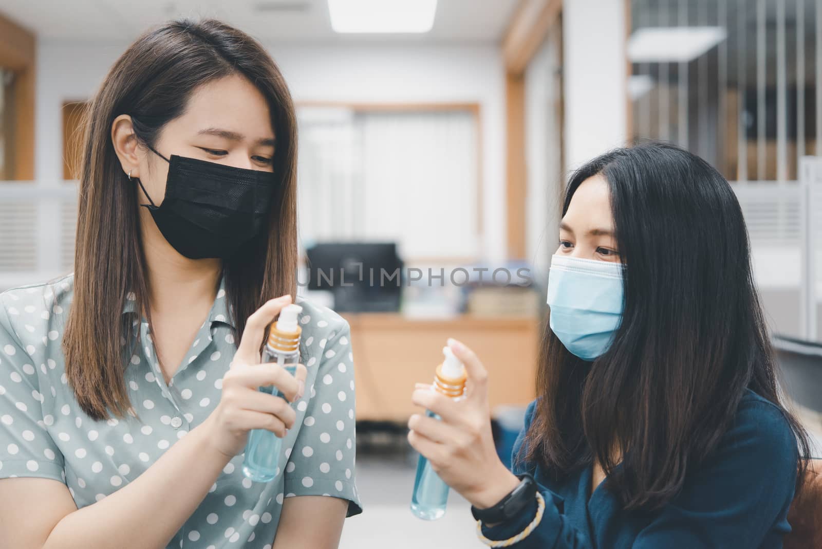 Asian women wearing mask and alcohol antibacterial hand gel respiratory protection mask against epidemic flu covid19 or corona virus with fear emotion in concept illness, outbreak, healthcare in life