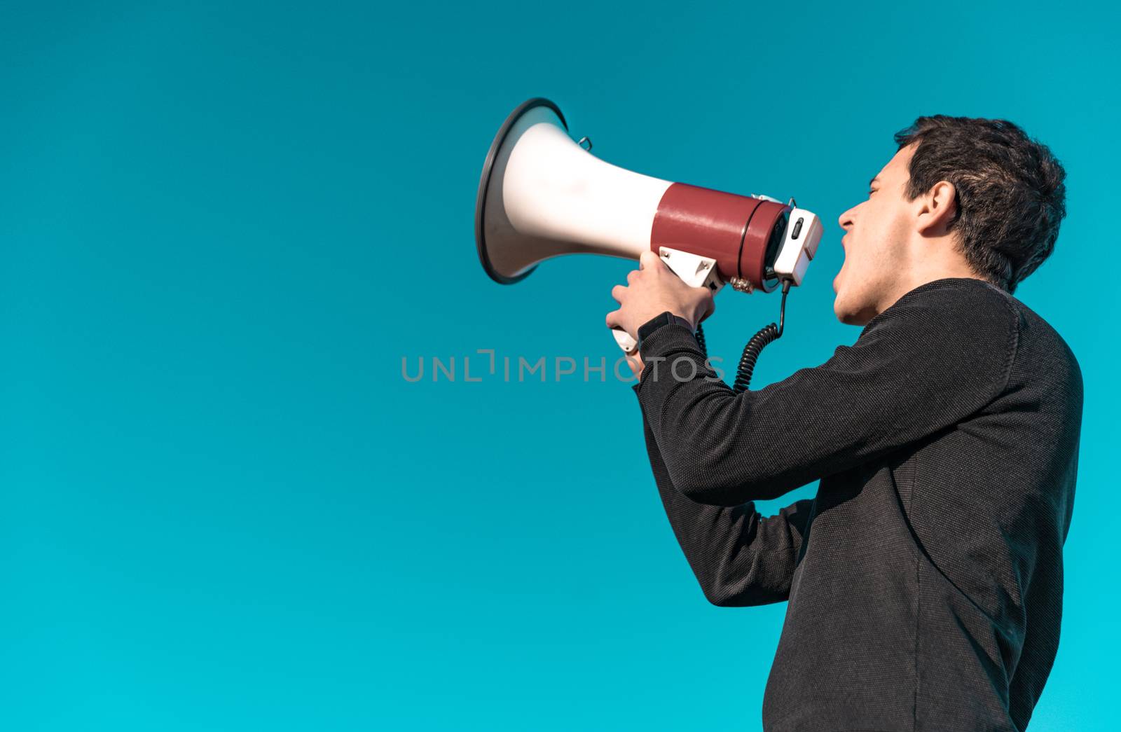 megaphone as a tool for loud communication of important news and information. Copy space. Isolated by Edophoto