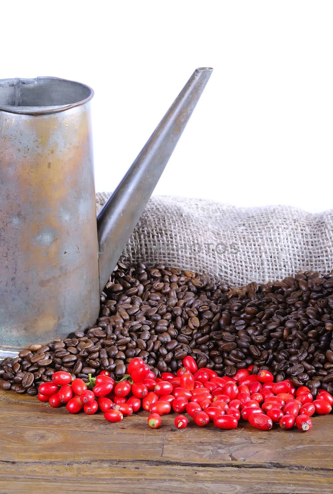 Coffee beans on a wooden table and white background