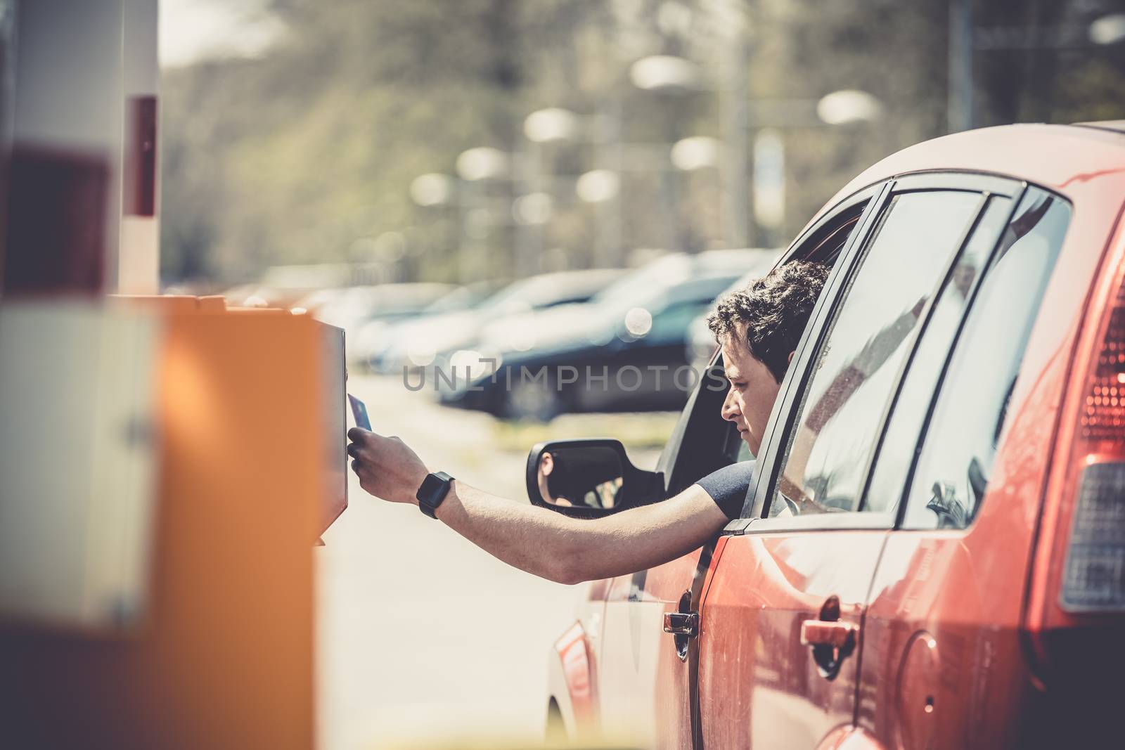 payment for parking by credit card. red car by Edophoto