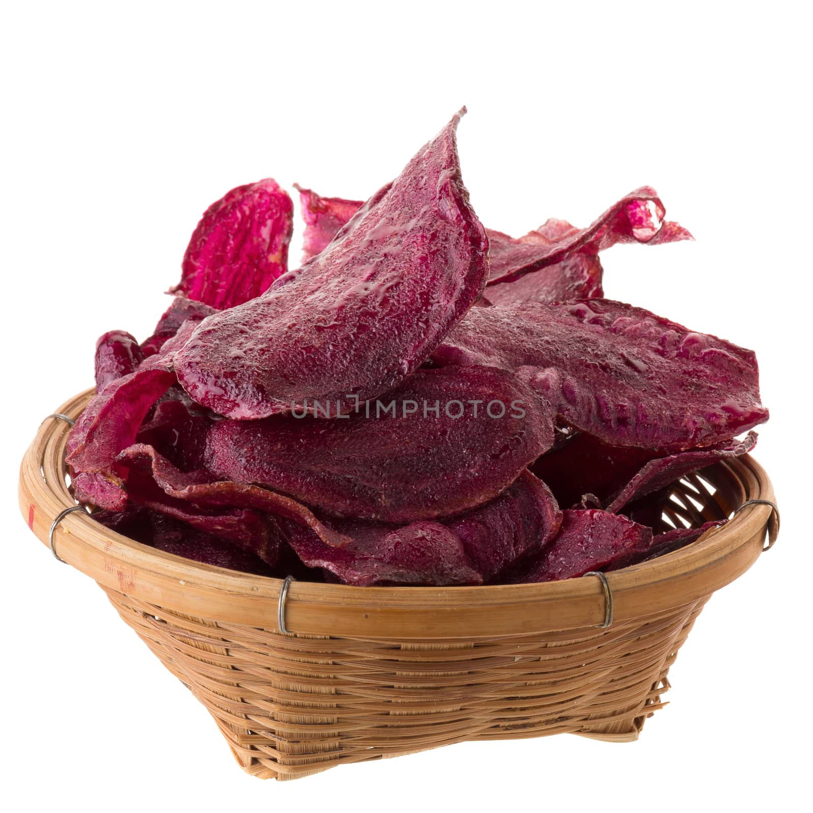 purple potatoes Sliced and fried crisps In the basket isolated on white background.