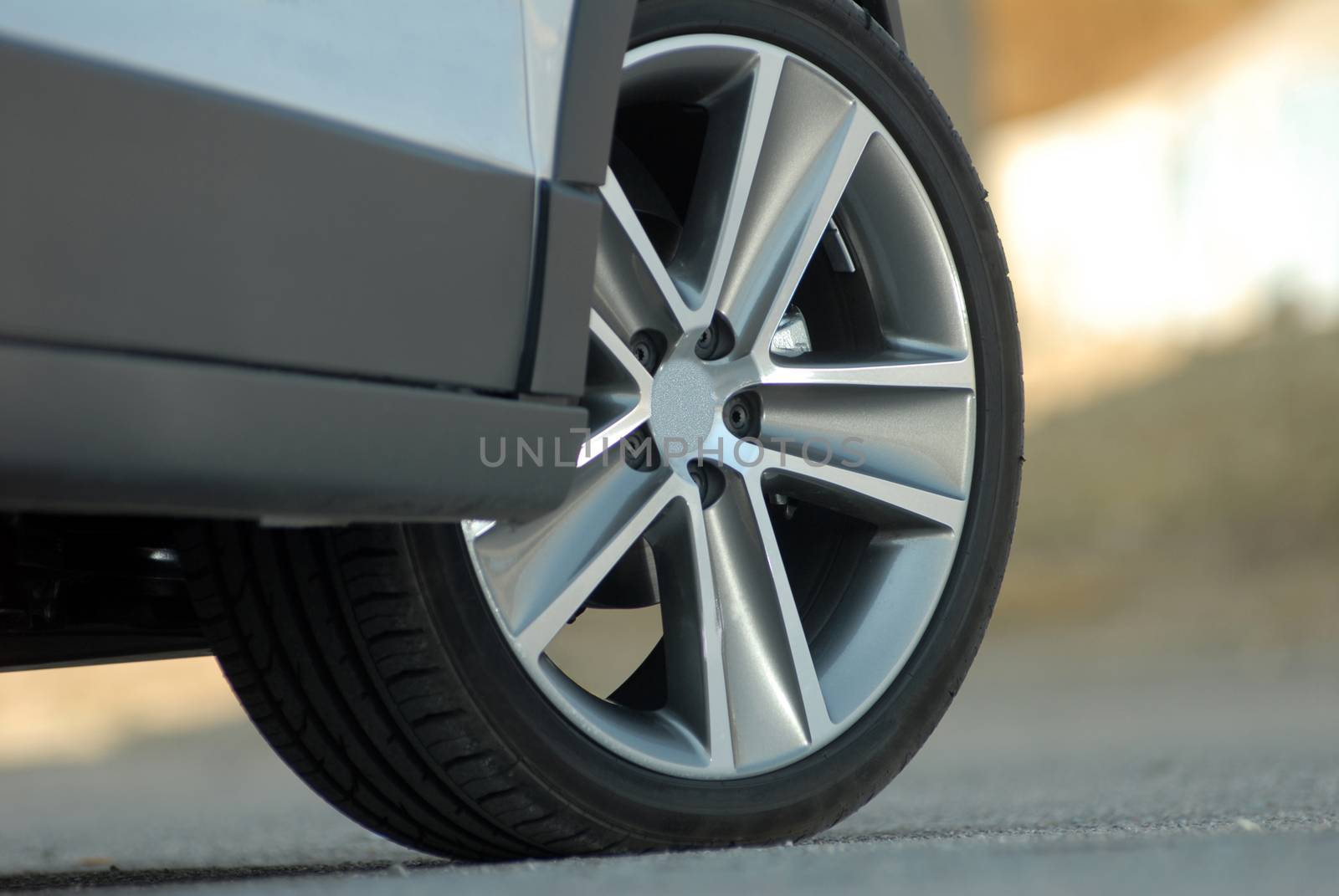 Wheel on a grey large luxury car