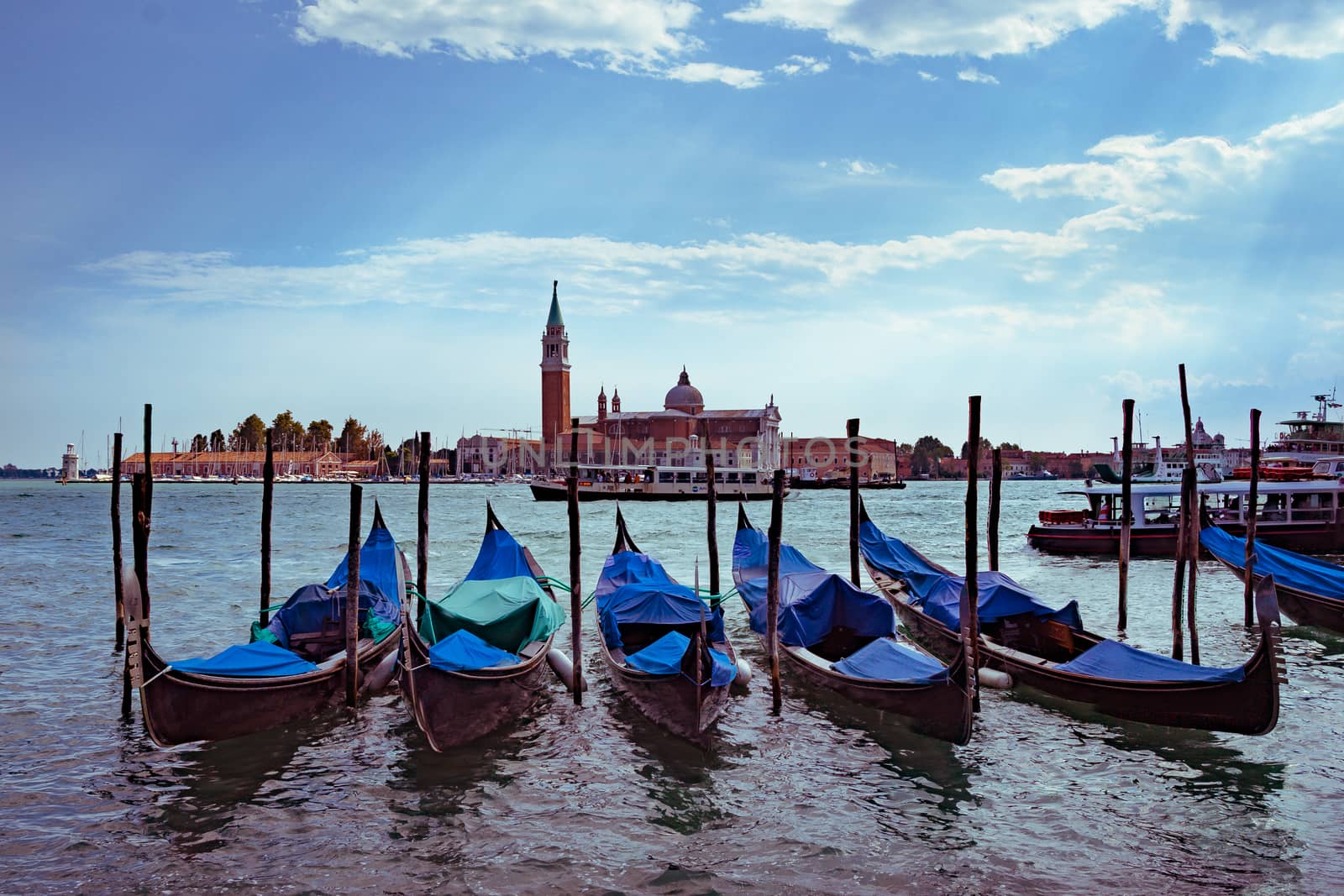 Gondolas in Venice - with San Giorgio Maggiore church. San Marco, Venice, Italy