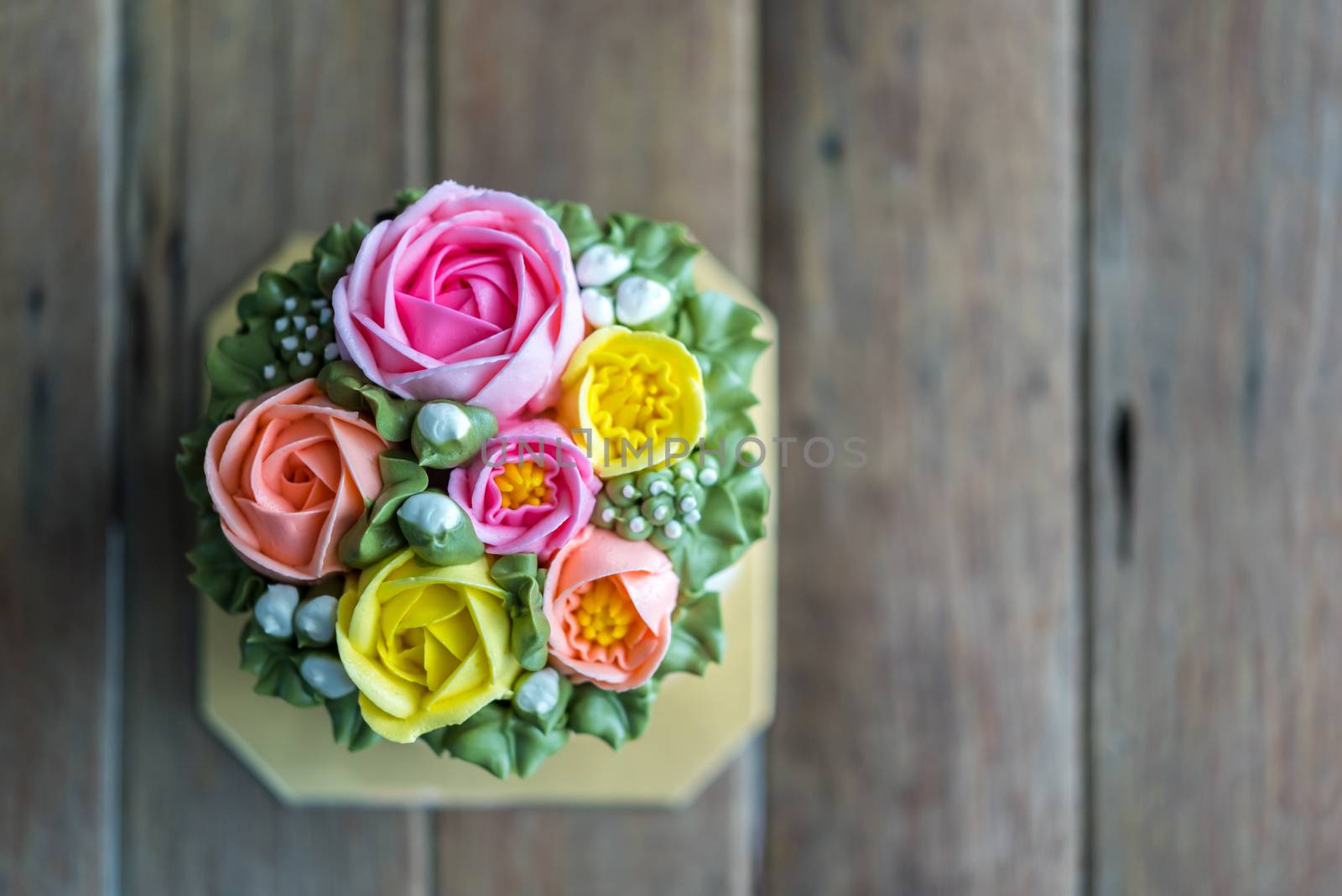 Cake cream is sweet dessert on wooden table by PongMoji