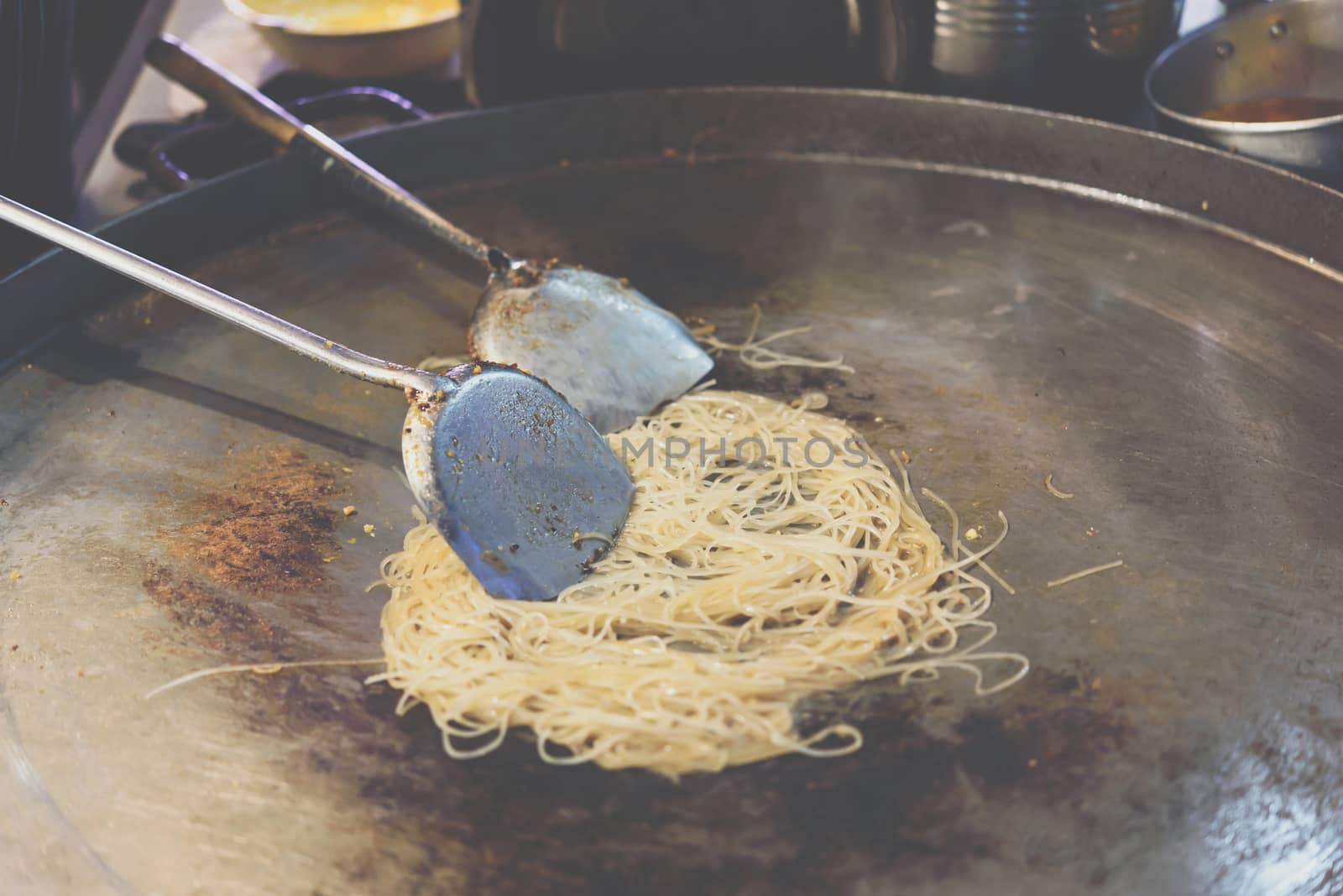 Fried noodle Thai style (Pad Thai) for sale at Thai street food market or restaurant in Thailand