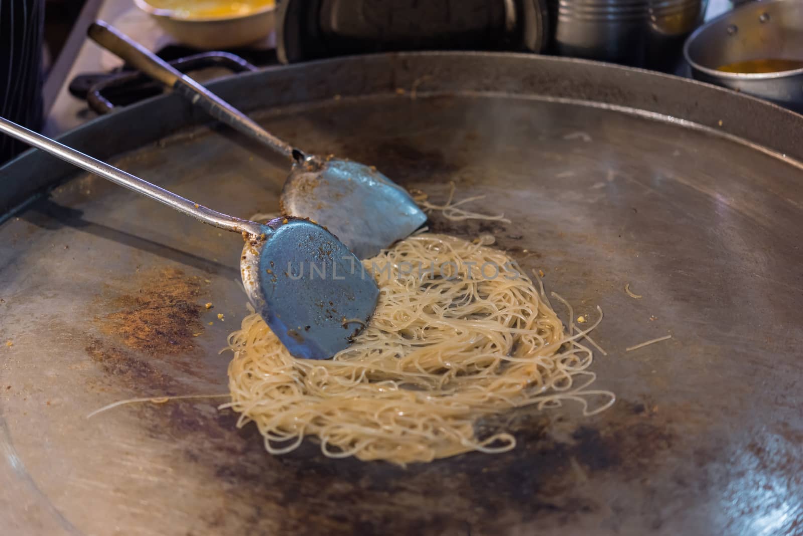 Fried noodle Thai style (Pad Thai) for sale at Thai street food market or restaurant in Thailand