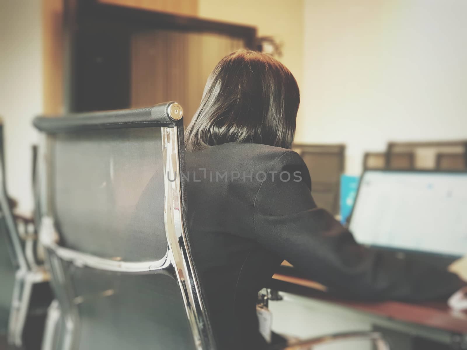 Business woman work by laptop in meeting room by PongMoji