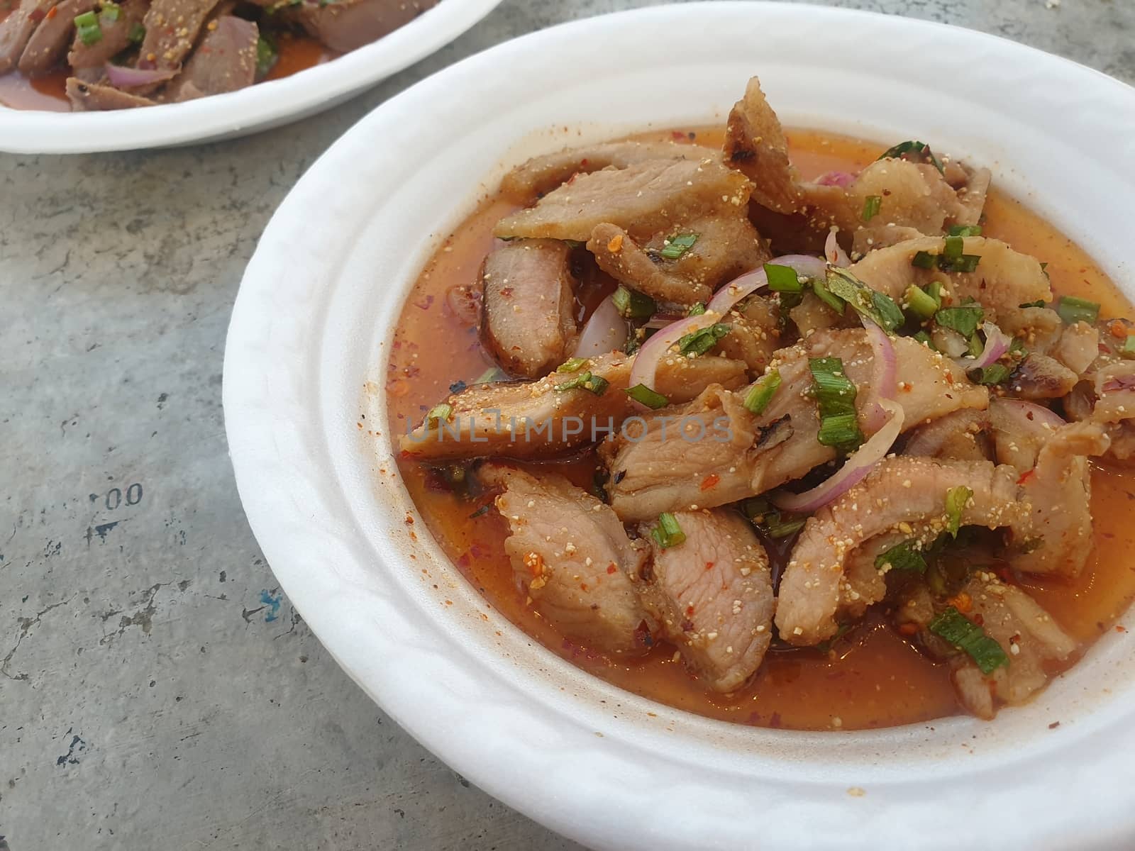 Spicy minced pork salad (Laab) at Thai street food by PongMoji