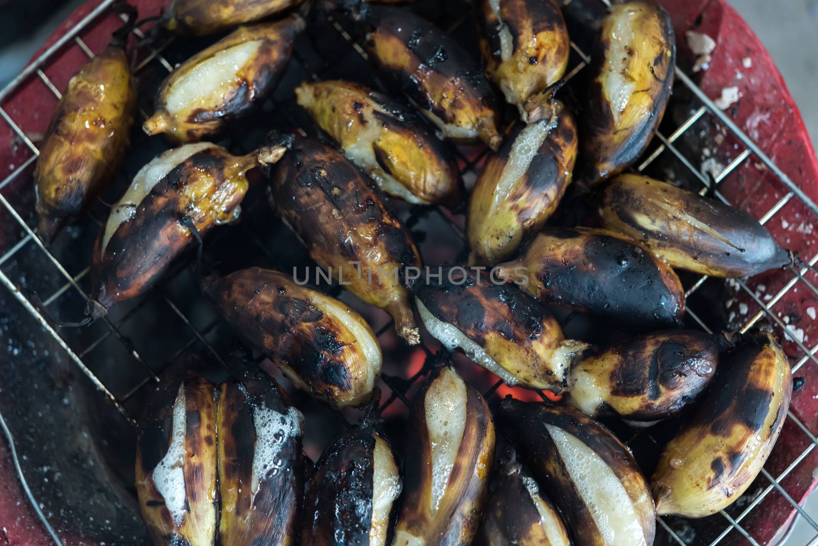 Roasted or Grilled Banana for sale at Thai street food market or restaurant in Thailand