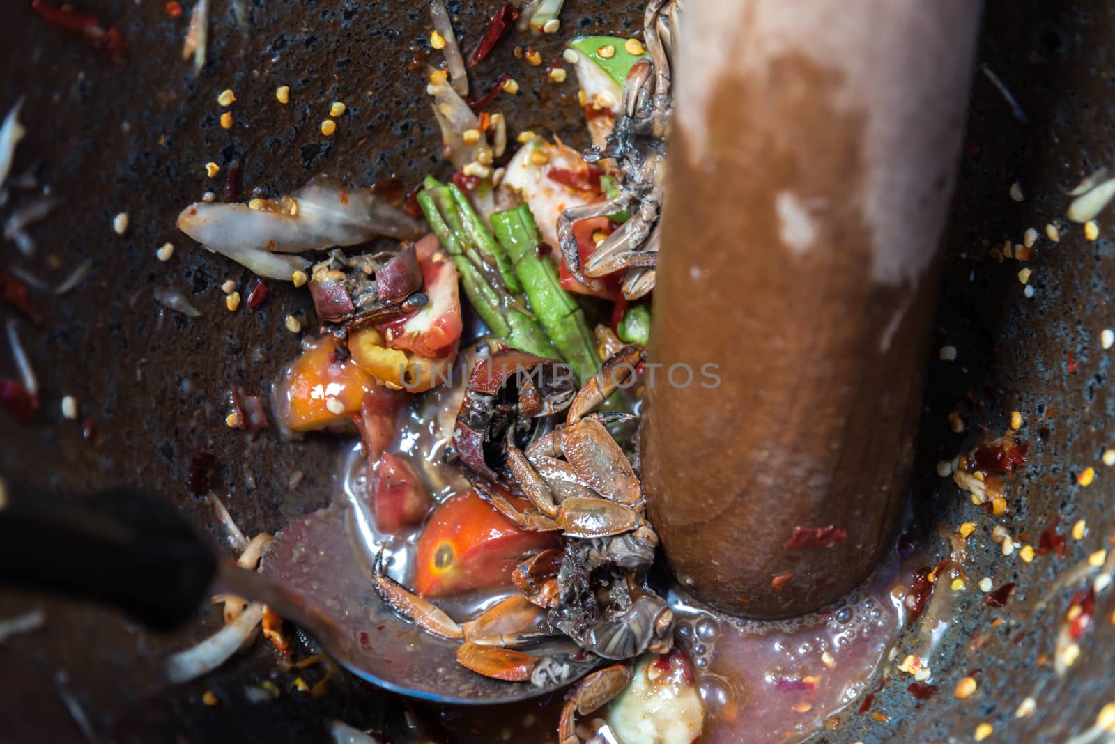 Papaya salad or Papaya Pok Pok (Som tum) for sale at Thai street food market or restaurant in Thailand