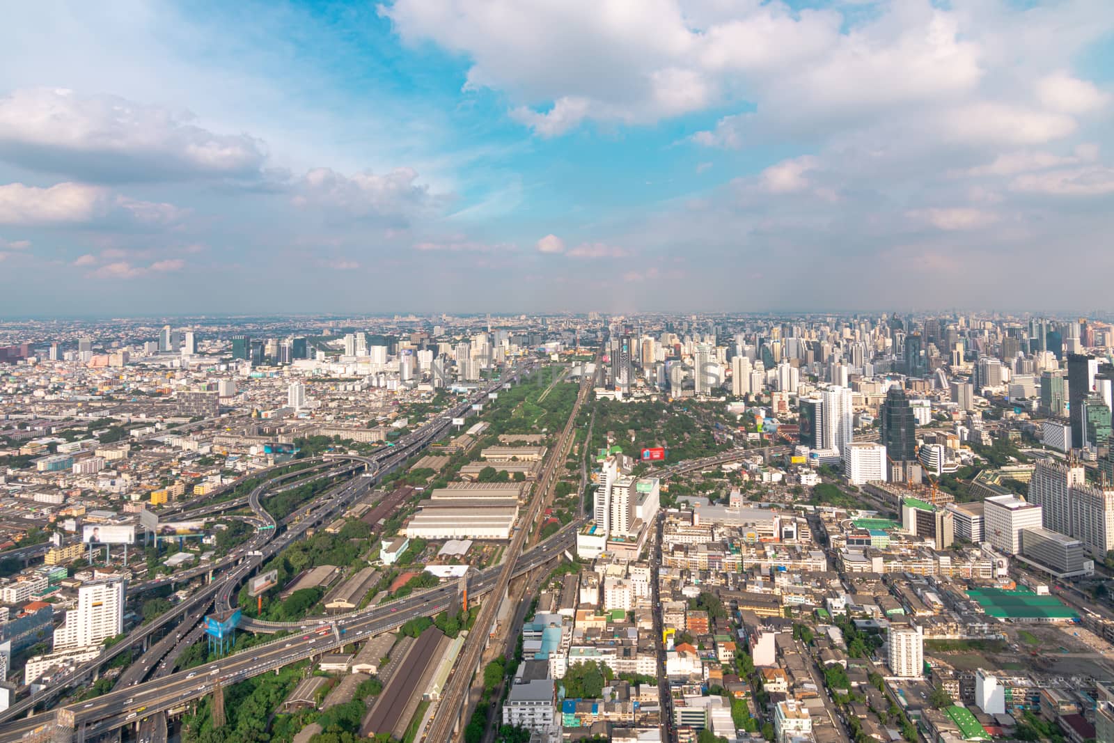 Cityscape and transportation with expressway and traffic in daytime from skyscraper of Bangkok. Bangkok is the capital and the most populous city of Thailand.