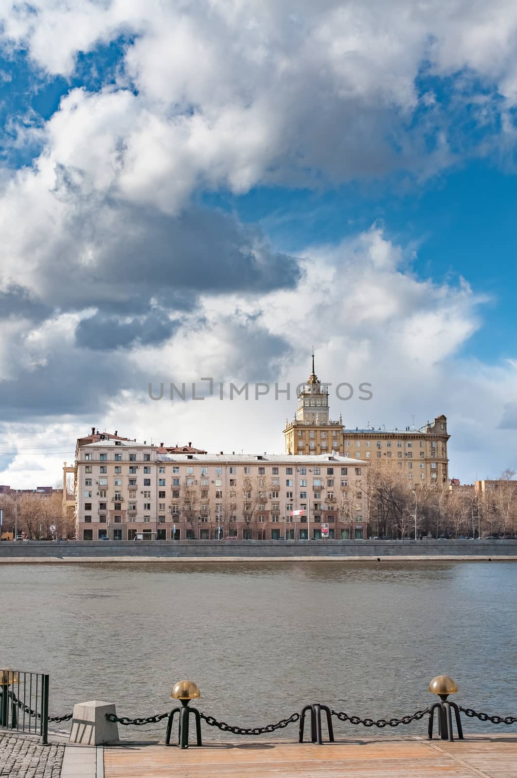 View of the Frunze Embankment on the Moskva river in the Khamovniky district in Moscow, Russia. House 24/1. Residential building with a tower.  Architects B.S. Mezentsev, S.P. Turgenev - 1950-1953