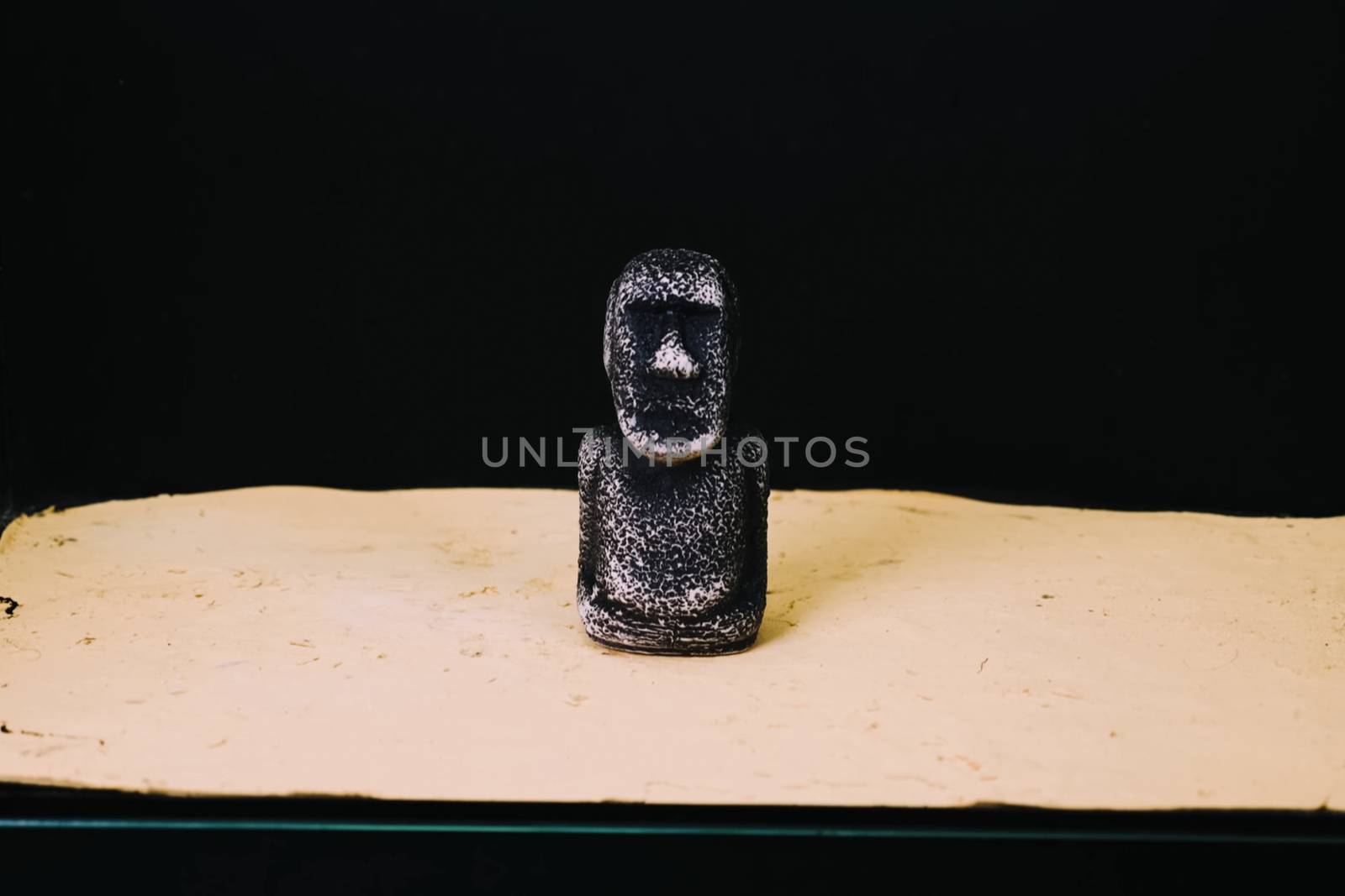 mock statue from Easter Island. A stone man on the sand. by DePo
