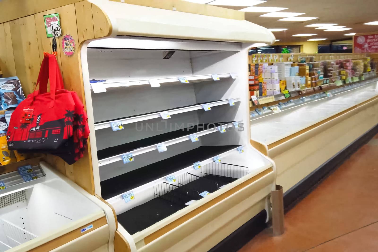 Empty shelves with groceries in supermarkets because of the panic from the coronavirus. by DePo