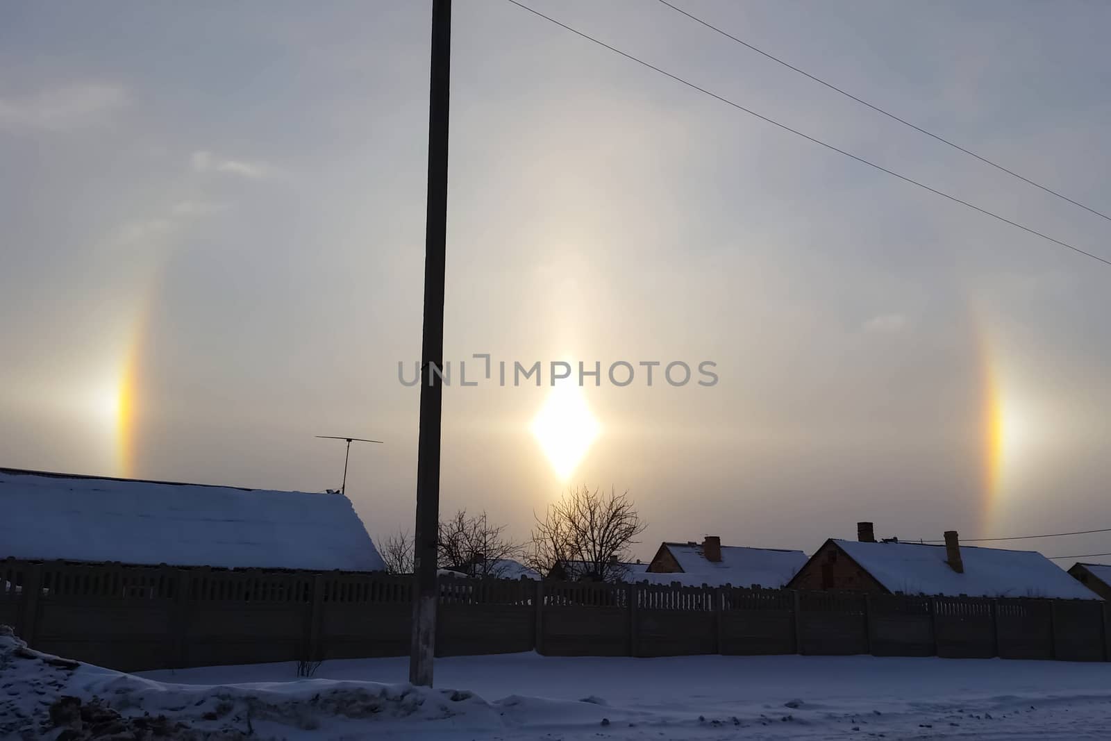 phenomenon of halo in the sky. A rare natural phenomenon. Three halo suns. by DePo