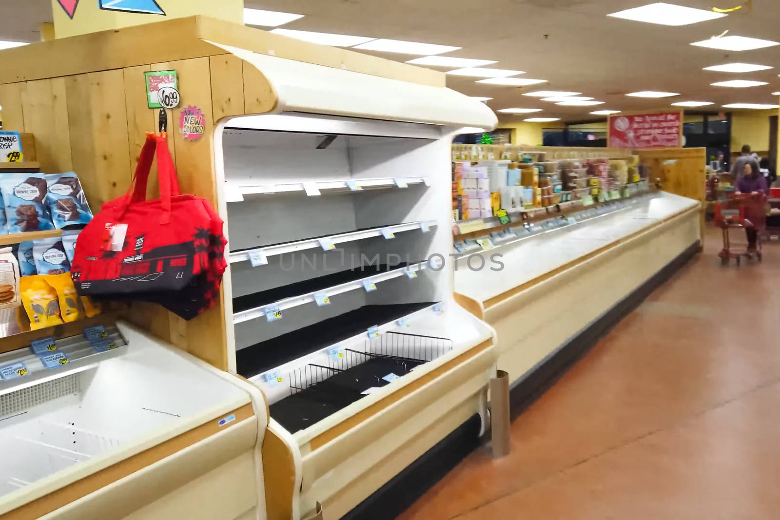 Empty shelves with groceries in supermarkets because of the panic from the coronavirus. by DePo