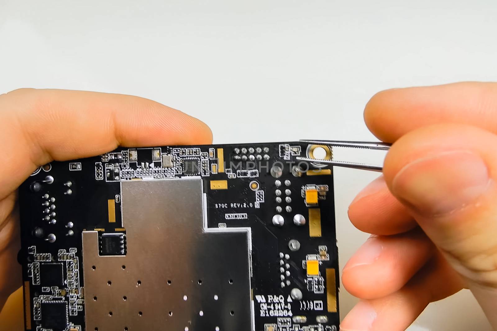 Repair electronics, tweezers as tool for taking small parts from the micropayment. by DePo