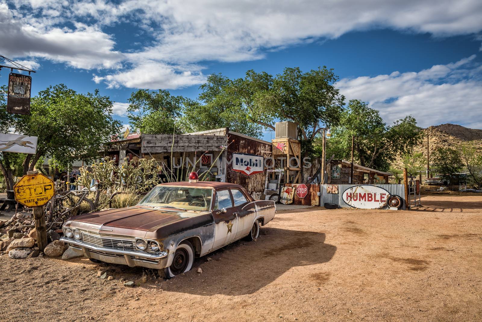 Old sheriff's car with a Siren in Hackberry, Arizona by nickfox