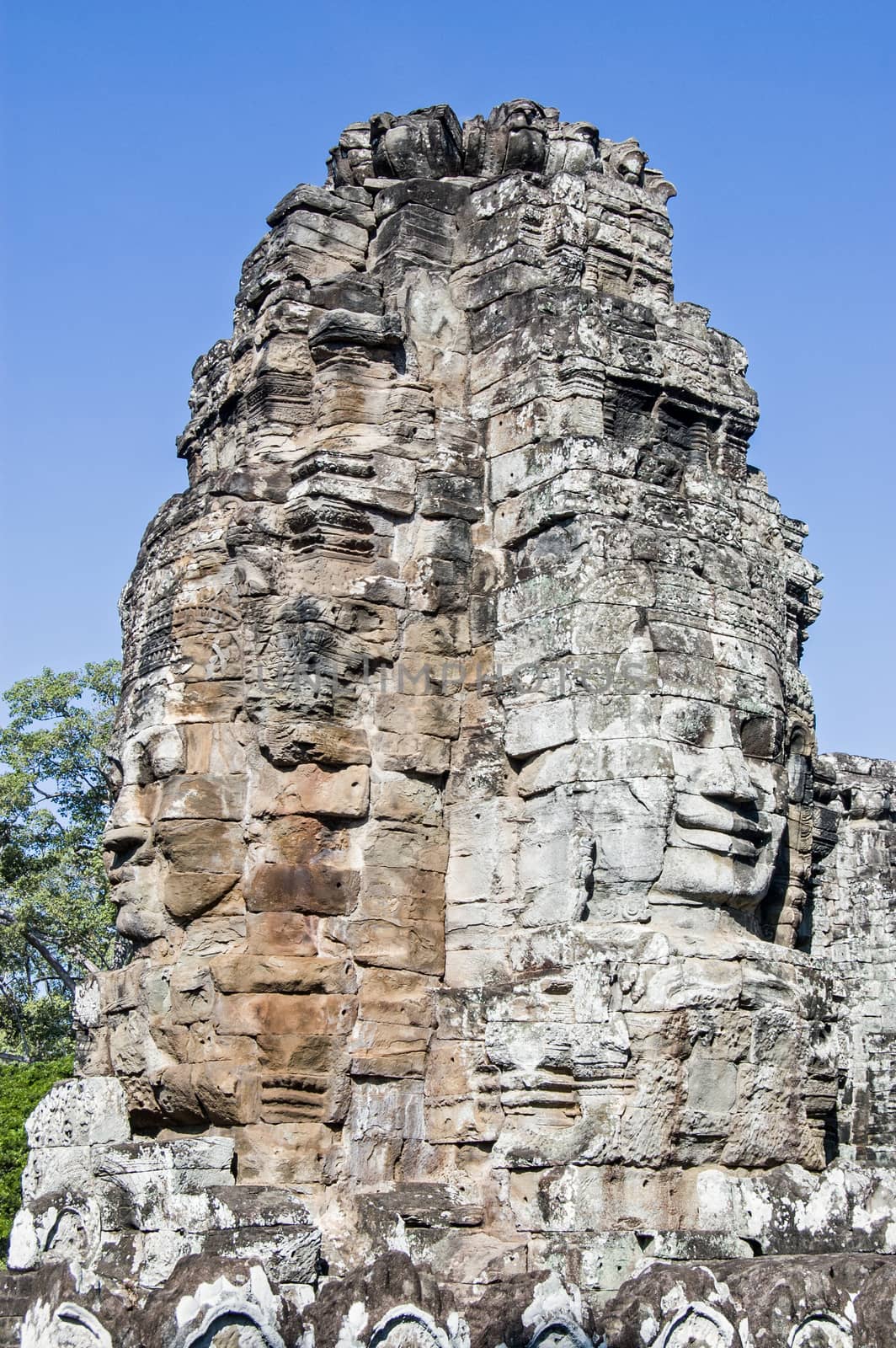 Faces of Bayon Temple, Cambodia by BasPhoto